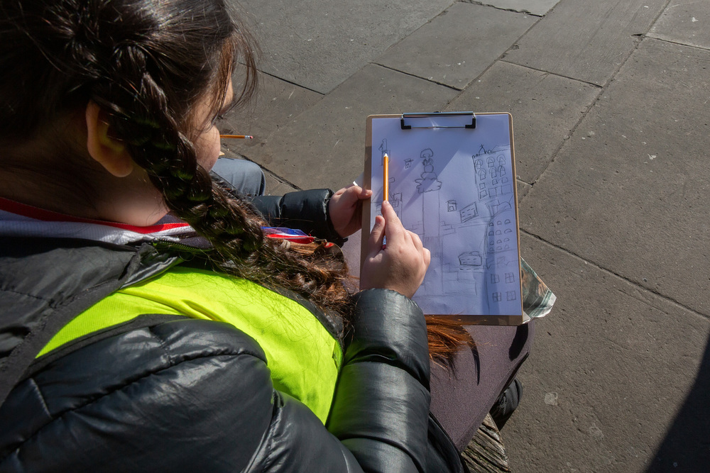A young artist from Nelson School in London sketching in Trafalgar Square