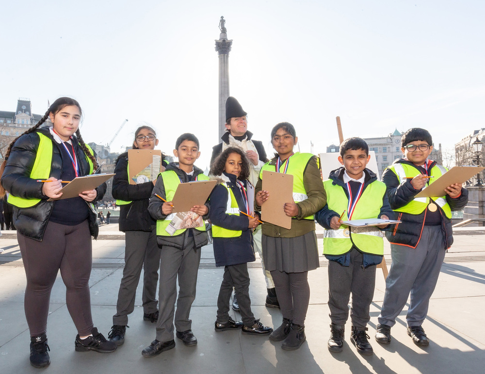 Pupils from Nelson School in Newham sketching in Trafalgar Square