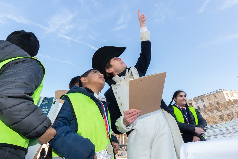 Lapenotiere helps pupils from Nelson School in Newham to sketch their pictures of Lord Nelson